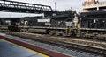 Three Railroad Engines Pulling Mile Long Railcars